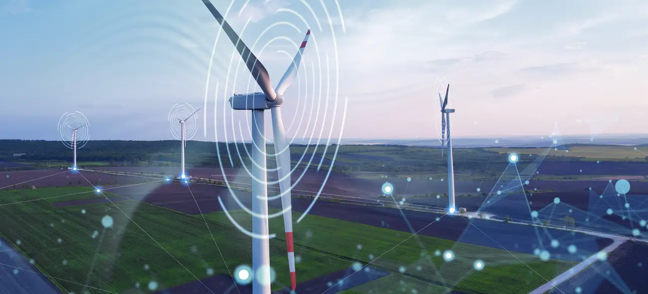 Wind turbines in a green landscape with digital graphics and data points. Wind turbines in a green landscape with digital graphics and data points.